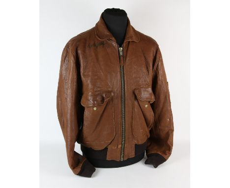 Autographed Leather jacket  a brown leather jacket, lined, Signed in an unknown hand on the left breast and further Signed an