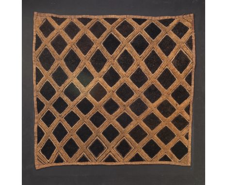 A Kuba textile panel, Democratic Republic of Congo, 20th century; 
with raised textured geometric lattice and lozenge pattern