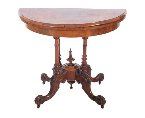 A Victorian walnut and inlaid half round card table, bordered with boxwood lines, the baize lined hinged top with a moulded e