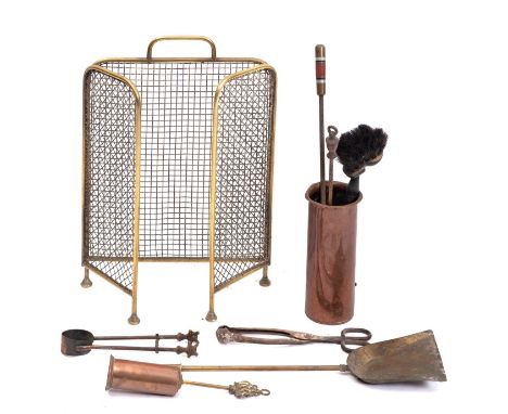A quantity of hearthside metalware, 19th and early 20th century; including a brass and mesh fireguard; a brass shovel; tongs,