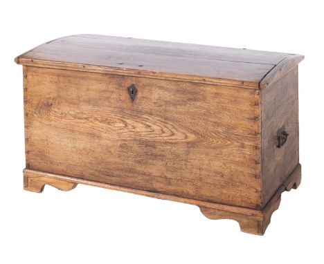 A 19th Century oak domed rectangular trunk, with a hinged top and iron carrying handles to the sides, on bracket feet, 125cm 