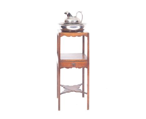A George III mahogany washstand, last quarter 18th century; the top with circular aperture, the undertier with drawer; above 