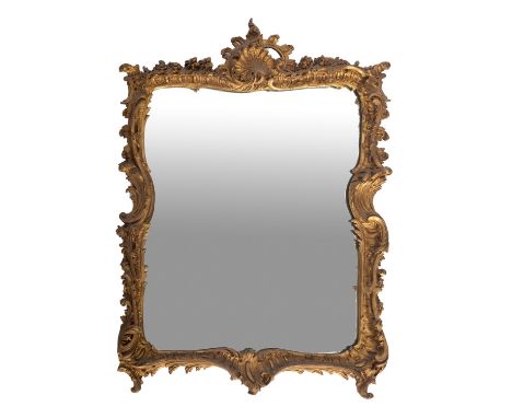 A gilt composition framed rectangular wall mirror in Rococo taste, last quarter 20th century; the surround with scrolling fol