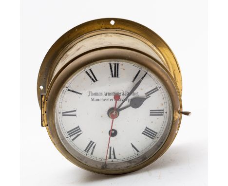Thomas Armstrong & Brother, a brass bulkhead clock having an eight-day duration timepiece movement with platform escapement, 