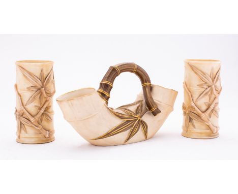 A pair of Victorian Royal Worcester aesthetic movement bamboo vases, puce mark, 1886, with a bamboo jug, 1888, (3)

Provenanc