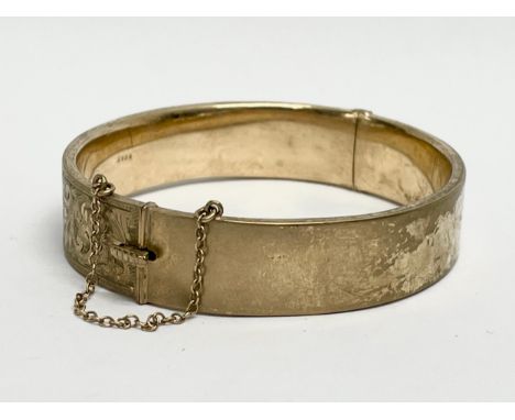 A 9ct gold gold bangle. 17.69 grams. 