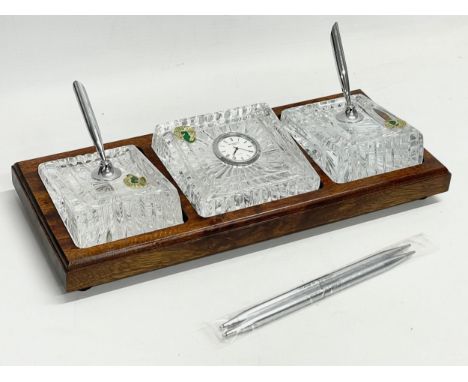 A Waterford Crystal desktop pen and clock set in box. 31x13cm. Box measures 36x33cm 