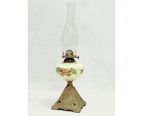 An Edwardian oil lamp with hand painted glass bowl and brass base. 52cm 