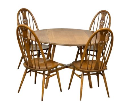 An Ercol Mid Century Elm and Beech drop leaf dining table and 4 chairs. Open 114x124x72cm 