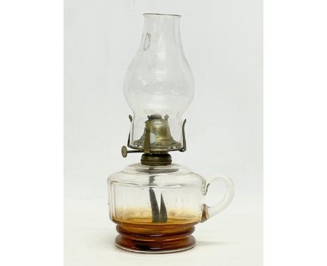 An Edwardian glass finger oil lamp. 15x27cm 