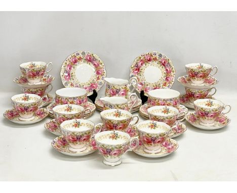 A 39 piece Royal Albert ‘Serena’ tea service. 2 milk jugs. 2 sugar bowls. 12 sandwich plates. 11 saucers and 12 tea cups. 