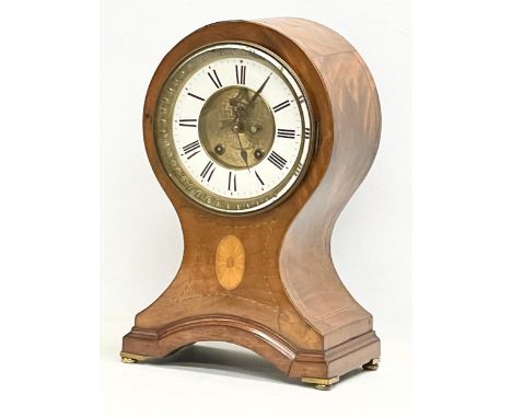 A large Edwardian inlaid mahogany balloon clock. With key and pendulum. 28x19x44cm 