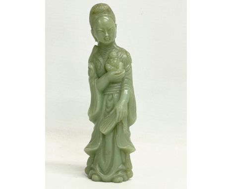 A Chinese jade figure. Early to mid 20th century. 15cm 
