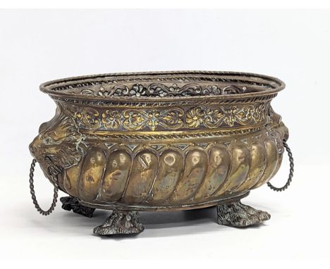An ornate 19th century planter with lion paw feet in the Regency style. 31x15.5cm 