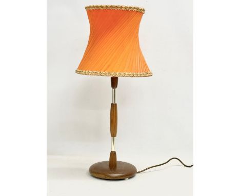 A tall Mid Century teak table lamp. 69cm 