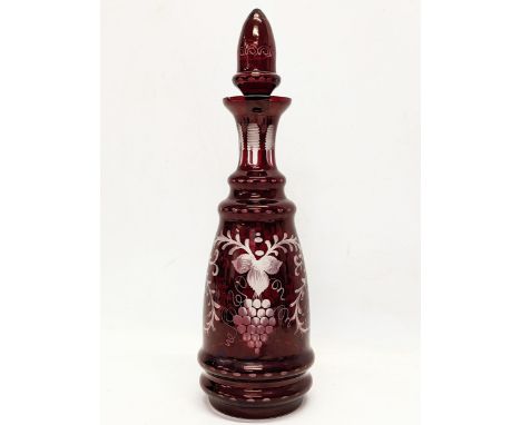A large late 19th century Bohemian etched Ruby Glass decanter. 37cm 