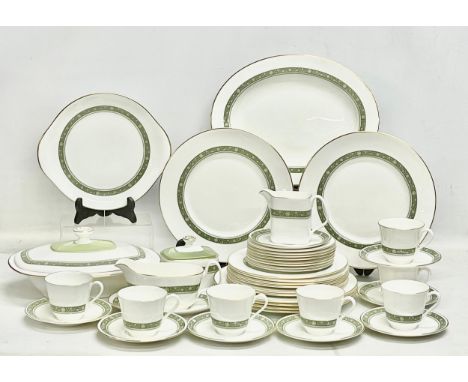 A 42 piece Royal Doulton ‘Rondelay’ tea and dinner service. 6 dinner plates. Platter. 6 salad plates. 8 sandwich plates. Ture