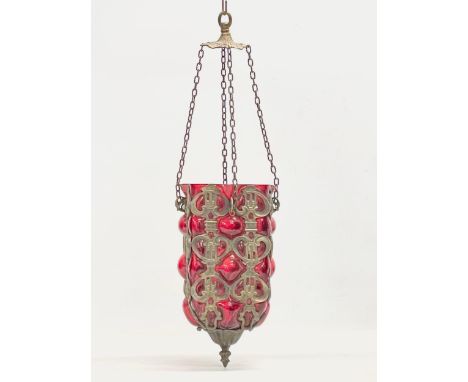 A vintage Ruby Bubble Glass brass bound light fitting. Shade measures 14x14x28cm. 77cm including chain. 