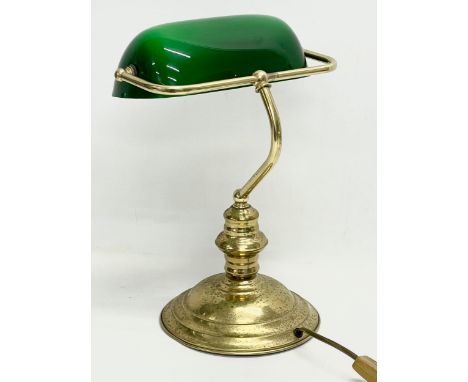 A brass desk lamp with glass shade. 28x37cm 