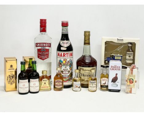 A collection of alcohol. A bottle of Teachers Highland Cream Scotch Whisky Merry Christmas, 5cl. 2 Harveys Bristol Cream Sher