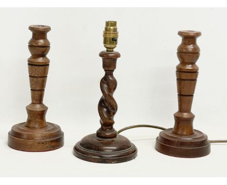 A pair of vintage candlesticks and an oak Barley Twist table lamp. 28cm 