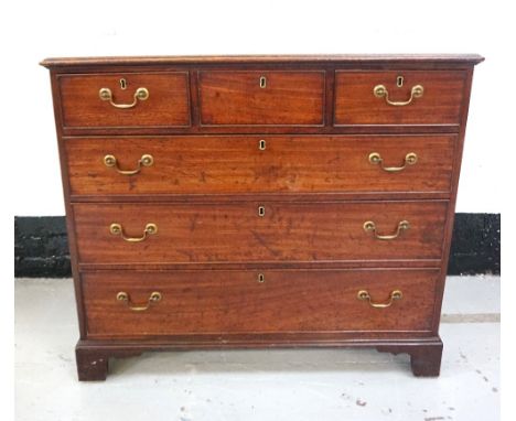 GEORGE III MAHOGANY CHESTwith a moulded top above three frieze drawers with three graduated long drawers below, all with cock