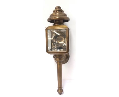 COACH LAMP STYLE WALL LIGHTin brass with a shaped top above three bevelled glass panels with a turned tapering column below, 