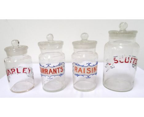 MIXED LOT OF GLASSWAREincluding four kitchen storage jars marked Biscuits, Currants, Raisins and Barley, a hand held small oi