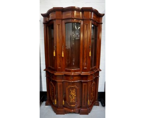 ITALIAN STYLE SERPENTINE FRONT ILLUMINATED SIDE CABINETthe upper section with three glazed doors and glass shelved interior, 