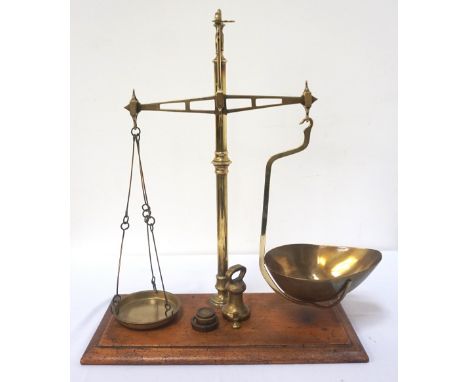 SET OF BRASS SHOP SCALESmarked 'Macnab of Paisley' with a removable shaped goods trough and a circular weights dish, mounted 