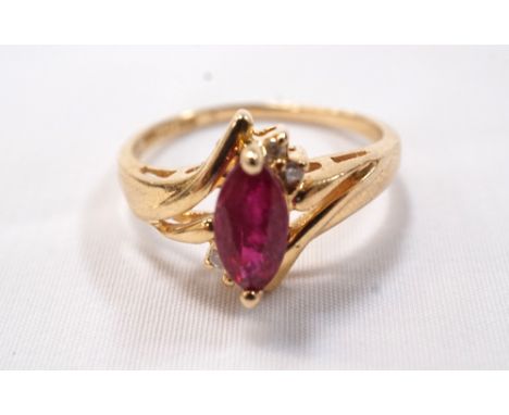 RUBY AND DIAMOND RINGthe central marquise cut ruby in diamond set twist setting, on fourteen carat gold shank, ring size M