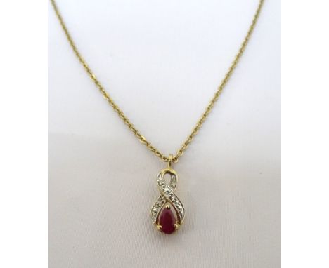 RUBY AND DIAMOND PENDANTthe pear cut ruby in diamond set nine carat gold twist setting, on gilt neck chain 