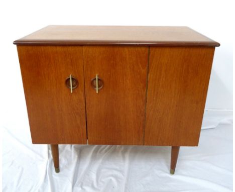 RETRO 1960s TEAK RECORD CABINETwith double facing doors opening to reveal an upper open shelf above the record compartments, 