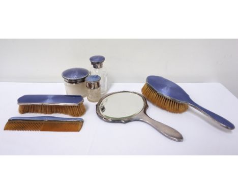 GEORGE V SILVER AND ENAMEL DRESSING TABLE SETcomprising an oval hand held mirror, two hair brushes, comb, powder jar and two 