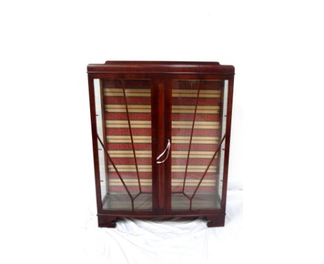1950s MAHOGANY DISPLAY CABINETwith a raised back above a pair of glass and beaded doors and glass side panels, the interior w