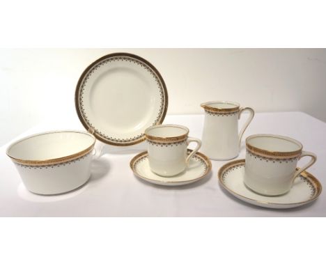 'BALMORAL CHINA' COFFEE SERVICEwith gilt rim detail on white ground, comprising nine cups, twelve saucers, twelve side plates