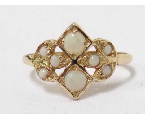 OPAL CLUSTER RINGin pierced setting, on nine carat gold shank, ring size O-P