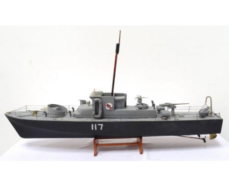 BRITISH WORLD WAR II NAVAL RADIO CONTROLLED BOATwith removable wheel house revealing electric motors, with front and rear mou