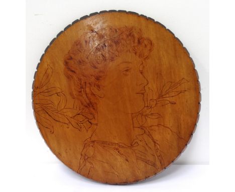 EDWARDIAN PENWORK CIRCULAR WALL PLAQUEdepicting the portrait of a young lady, 33.5cm diameter