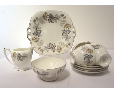 COALPORT 'CAMELOT' BONE CHINA TEA SERVICEcomprising thirteen cups, fourteen saucers, twelve side plates, two cake plates, sug