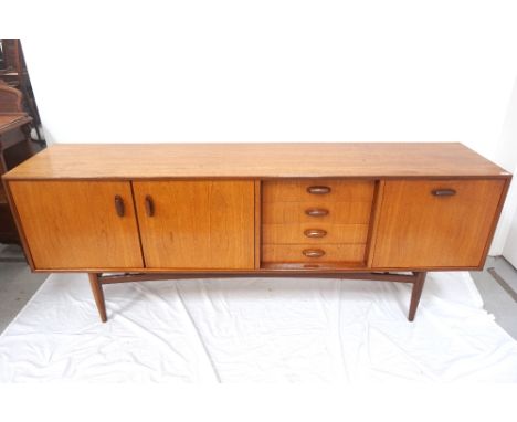 RETRO 1960s 'G PLAN' TEAK SIDEBOARDby 'E.Gomme High Wycombe', the central four drawer section flanked by a double door cupboa