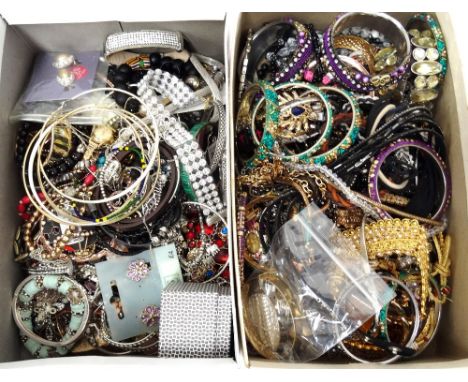 SELECTION OF COSTUME JEWELLERYincluding a rolled gold bangle, other bangles and bracelets, necklaces, pendants, earrings, and