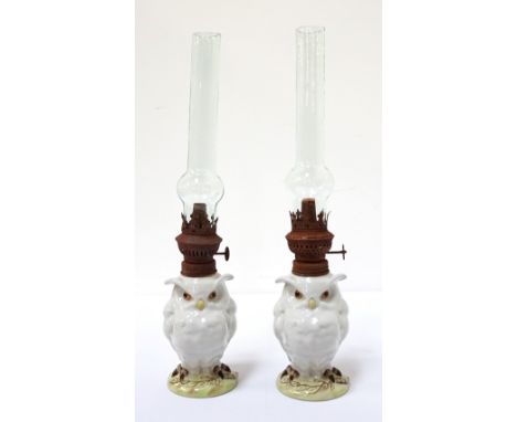 PAIR OF PORCELAIN 'OWL' OIL LAMPSwith handpainted detail, bearing stylised crossed swords above the letter 'R' to bases, 13cm