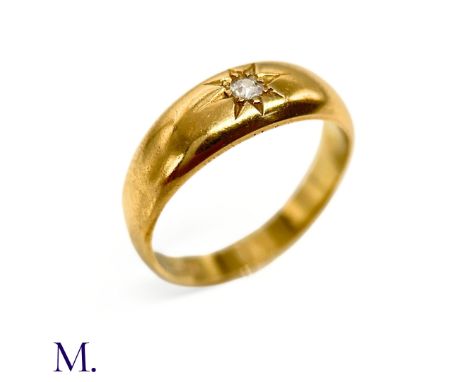 An Antique Diamond Gypsy Ring The gold band is set with a 5pt diamond and is marked '18ct'. Box not included; for display onl