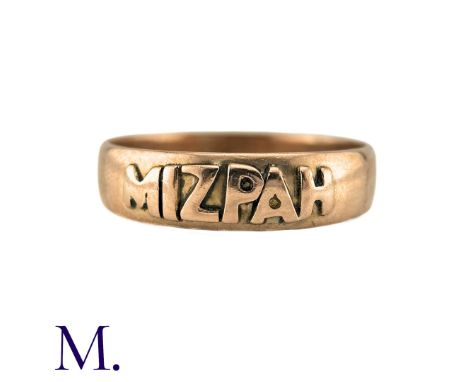 An Antique Mizpah Ring in 9k rose gold, the band ring is embossed to the front with the word 'mizpah'. Hallmarked for 9ct gol