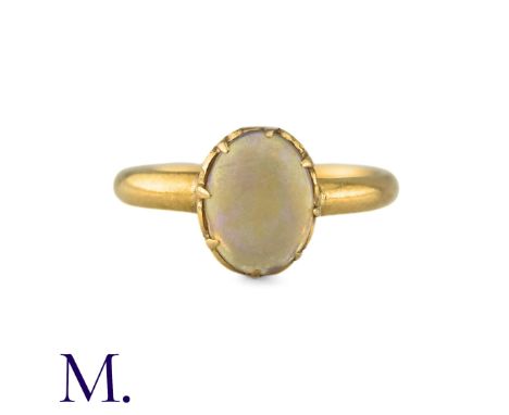 An Antique Opal Ring the central cabochon opal claw set to a gold band. (Unmarked but tests indicate 18ct gold.) Size: I1/2 W