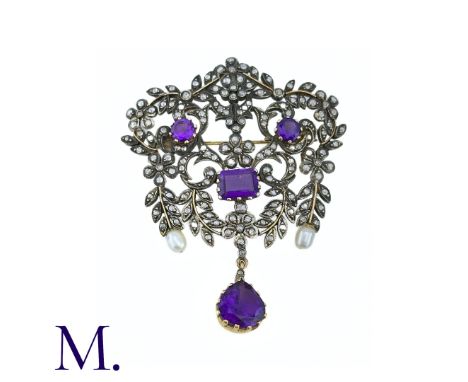 An Amethyst, Pearl And Diamond Brooch Pendant in silver and gold, in scrolling and foliate design, the diamond set brooch acc