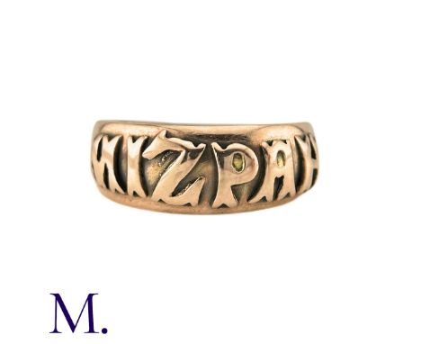 A Mizpah Ring in 9k yellow gold, the band ring is embossed to the front with the word 'mizpah'. Hallmarked for 9ct gold. Size