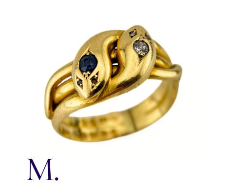 An Antique Sapphire And Diamond Snake Ring in 18k yellow gold, designed and two intertwined snakes one head set to the top wi