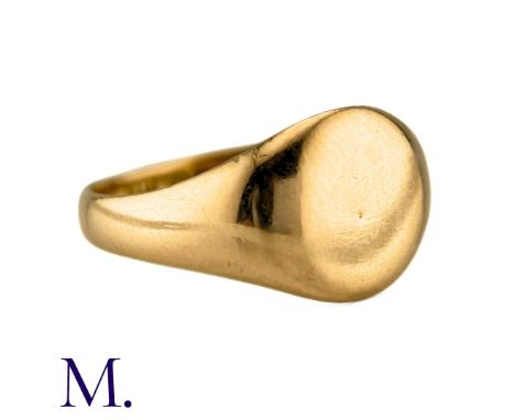 A Signet Ring in 18k yellow gold, the polished gold band with a blank face. Full British Hallmarks for 18ct gold. Size: T1/2 